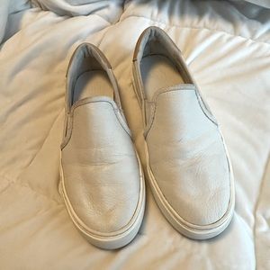 Pre owned Uggs slip on shoes. Size 6.5, white